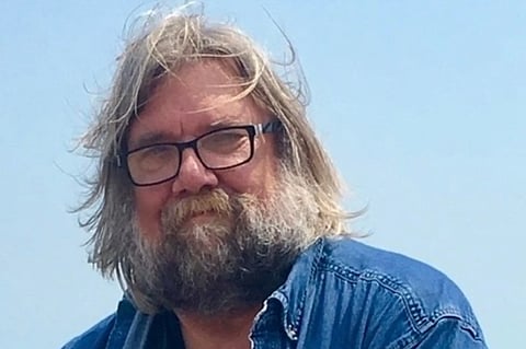 This undated photo released by Emily Joy Schumacher shows Michael Schumacher, a Wisconsin author who produced a diverse array of works ranging from biographies of filmmaker Francis Ford Coppola and musician Eric Clapton to accounts of Great Lakes shipwrecks.