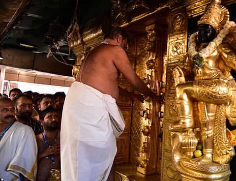 Thantri Kandararu Rajeevaru opening the sreekovil of Sabarimala temple