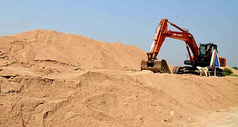 JCB excavating sand from quarry