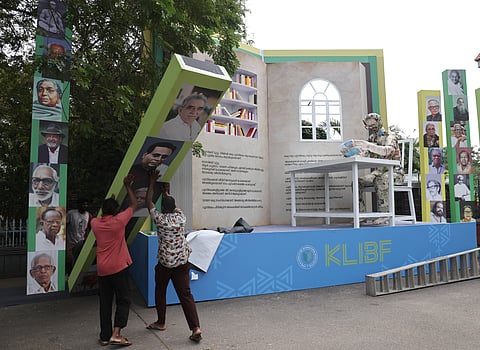 Workers put the finishing touches to an installation featuring portraits of eminent writers in front of the Kerala Legislative Assembly on Tuesday, on the eve of the Kerala Legislature International Book Festival, scheduled to be held from January 7 to 13.