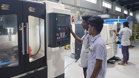 Students operating machinery during practical assessment in Industry 4.0 tech in the ITI campus in Madurai