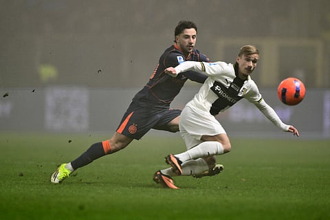 Inter Milan's Carlos Augusto (L) fights for the ball with Parma's Swedish midfielder Pontus Almqvist during the Italian Serie A football match between Parma and Inter Milan on January 7, 2026.