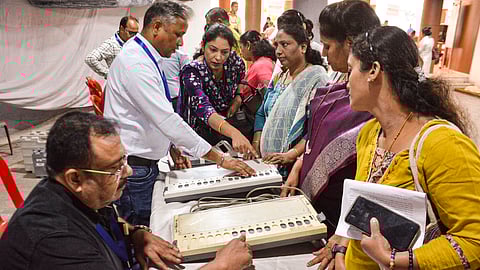 Polling officials take part in a training session on Electronic Voting Machines (EVMs) ahead of the Thane Municipal Corporation (TMC) election, in Thane, Maharashtra, Wednesday, Jan. 7, 2026.
