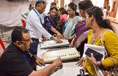 Polling officials take part in a training session on Electronic Voting Machines (EVMs) ahead of the Thane Municipal Corporation (TMC) election, in Thane, Maharashtra, Wednesday, Jan. 7, 2026.