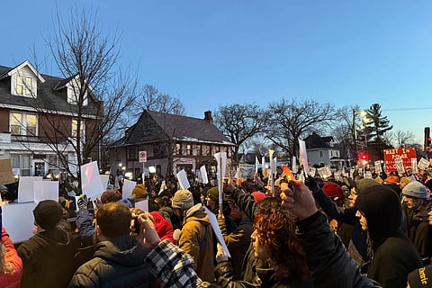Demonstrators gather during a vigil near where an Immigration and Customs Enforcement officer shot and killed a woman in Minneapolis, Wednesday, Jan. 7, 2026.