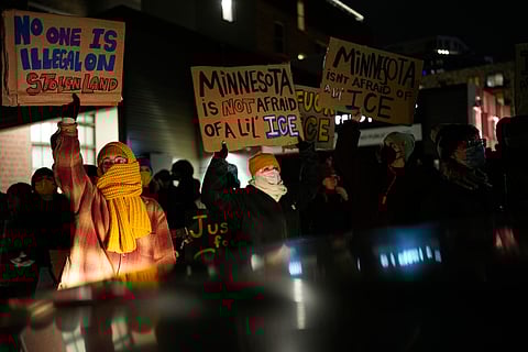 People participate in a protest and noise demonstration calling for an end to federal immigration enforcement operations in the city, Friday, Jan. 9, 2026, in Minneapolis.
