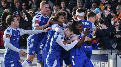 Macclesfield's English striker Isaac Buckley-Ricketts (R) celebrates with teammates after scoring the team's second goal during the English FA Cup third round match against Crystal Palace (Photo | AFP)