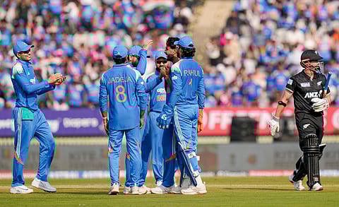 Harshit Rana celebrates with teammates after taking the wicket of New Zealand's Henry Nicholls during the first ODI cricket match of a series between India and New Zealand, at Kotambi Stadium in Vadodara, Gujarat, Sunday, Jan. 11, 2026.