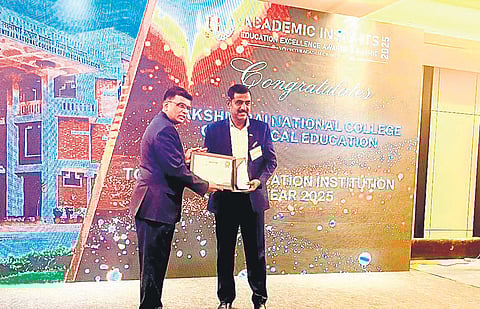 SAI LNCPE principal (in-charge) Pradip Dutta (Right) receiving the Top Sports Education Institution Award