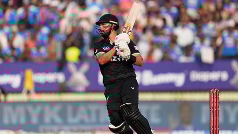 New Zealand's Daryl Mitchell plays a shot during the first One Day International cricket match between India and New Zealand in Vadodara, India, Sunday, Jan. 11, 2026.