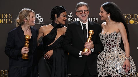 Sara Murphy, from left, Teyana Taylor, Paul Thomas Anderson, and Chase Infiniti pose in the press room with the award for best motion picture – musical or comedy for "One Battle After Another" during the 83rd Golden Globes on Sunday, Jan. 11, 2026, at the Beverly Hilton in Beverly Hills, Calif.