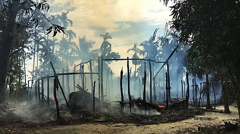 In this Sept. 7, 2017, file photo, smoke rises from a burned house in Gawdu Zara village, northern Rakhine state, where the vast majority of the country's 1.1 million Rohingya lived, Myanmar.