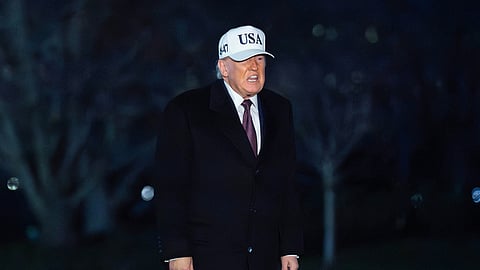 President Donald Trump talks to reporters as he walks on the South Lawn of the White House, Sunday, Jan. 11, 2026, in Washington.