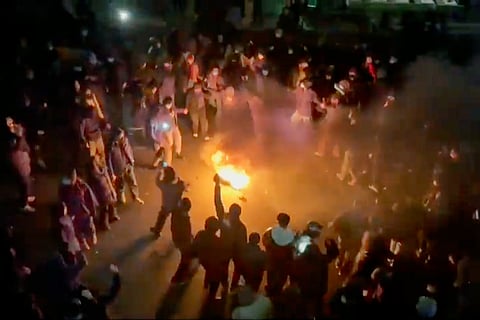 In this frame grab from footage circulating on social media shows protesters dancing and cheering around a bonfire as they take to the streets despite an intensifying crackdown as the Islamic Republic remains cut off from the rest of the world, in Tehran, Iran, Jan. 9, 2026.