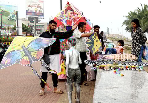 People buy kites on the Beach Road in Vizag on Monday.