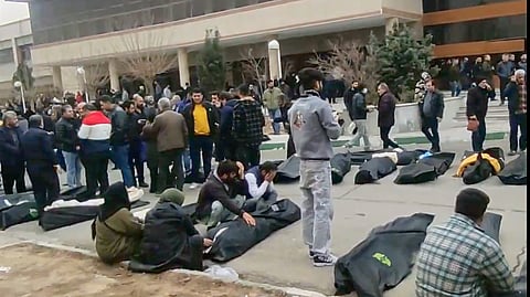 This frame grab from videos taken between Jan. 9 and Jan. 11, 2026, and circulating on social media purportedly shows images from a morgue with dozens of bodies and mourners after a crackdown on the outskirts of Iran's capital, in Kahrizak, Tehran Province.