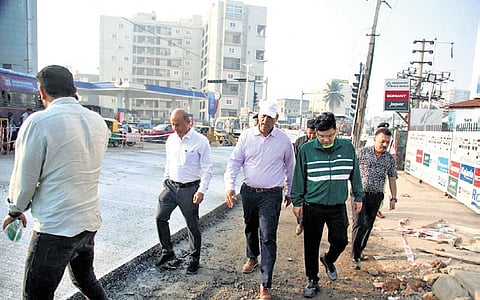 GBA Chief Commissioner Maheshwar Rao, along with officials, inspects
white-topping work on Hennur-Bagalur Road on Wednesday