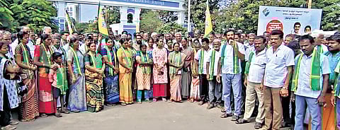 Poultry farmers stage protest in Tiruppur on Wednesday.