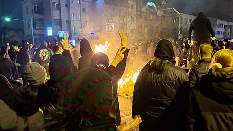 Iranians attend an anti-government protest in Tehran, Iran, Friday, Jan. 9, 2026.