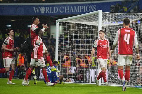 Arsenal's Viktor Gyoekeres, second right, celebrates after scoring his side's second goal during the English League Cup semifinal first leg soccer match between Chelsea and Arsenal in London, Wednesday, Jan. 14, 2026.