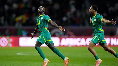 Senegal's Sadio Mane, left, celebrates after scoring his side's opening goal during the Africa Cup of Nations semifinal soccer match between Senegal and Egypt, in Tangier, Morocco, Wednesday, Jan. 14, 2026.