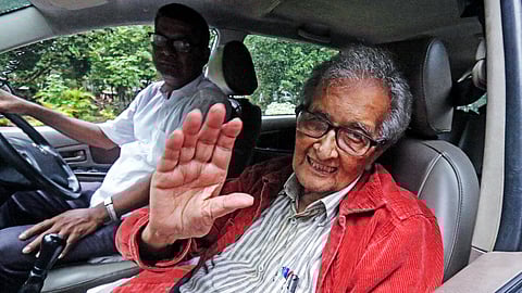In this photo from Aug. 22, 2025, Nobel Laureate Amartya Sen waves to well-wishers from his car after he comes out of his ancestral home, ‘Pratichi’, in Birbhum.