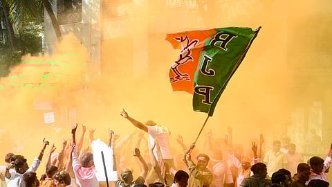 BJP workers celebrate the party's victory in the Navi Mumbai Municipal Corporation (NMMC) elections at Kopar Khairane, in Navi Mumbai, Maharashtra, Friday, Jan. 16, 2026.