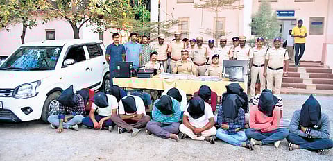 Police with arrested accused in Bhu Bharati lscam in Warangal on Friday.