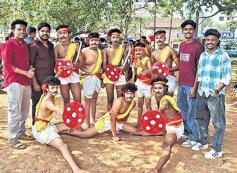 Little Flower HSS, Edava, team with the school alumnus who trained them in parichamuttukali for the kalolsavam.
