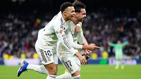 Real Madrid's Raul Asencio, right, celebrates with teammate Kylian Mbappe after scoring his side's second goal during the Spanish La Liga soccer match between Real Madrid and Levante in Madrid, Spain.