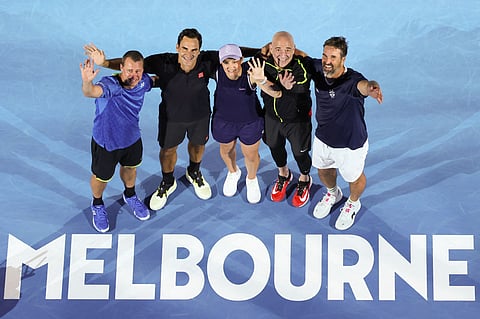 (L-R) Australia's Lleyton Hewitt, Switzerland's Roger Federer, Australia's Ashleigh Barty, USA's Andre Agassi and Australia's Pat Rafter pose after a doubles match during the opening ceremony of the Australian Open on Saturday