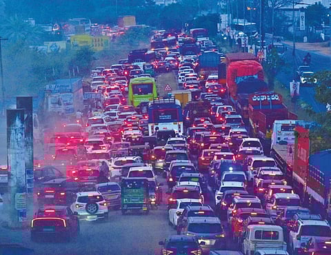 Vijayawada to Hyderabad roads witnessed heavy traffic as the people en route to Telangana after the Sankranti vacation,at Ibrahimpatnam near Vijayawada on saturday. Express photo by.