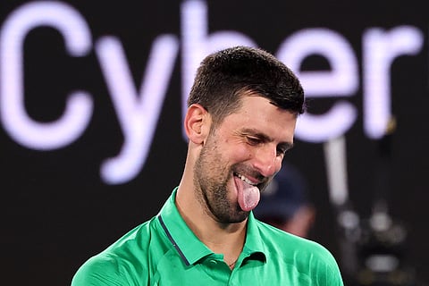 Serbia's Novak Djokovic reacts on a point to Spain’s Pedro Martinez during their men's singles match on day two of the Australian Open tennis tournament in Melbourne.