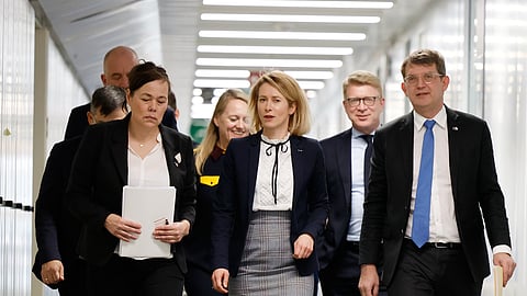 European Union foreign policy chief Kaja Kallas, center, walks with Minister for Foreign Affairs and Research of Greenland Vivian Motzfeldt, front left, and Denmark's Defense Minister Troels Lund Poulsen, front right, prior to a meeting at EU headquarters in Brussels, Monday, Jan. 19, 2026.