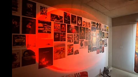 Sunset lamp throws light on a wall of film posters