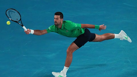 Novak Djokovic of Serbia plays a forehand return to Pedro Martinez of Spain during their first round match at the Australian Open.