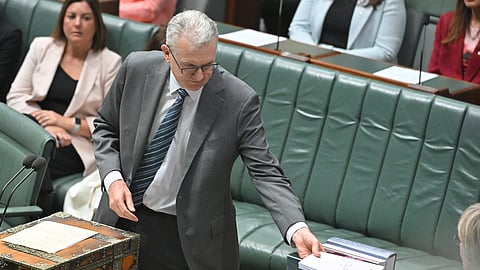 Australia's Minister for Home Affairs, Tony Burke, presents the Combatting Antisemitism, Hate and Extremism bill during a parliament sitting in Canberra, Tuesday, Jan. 20, 2026