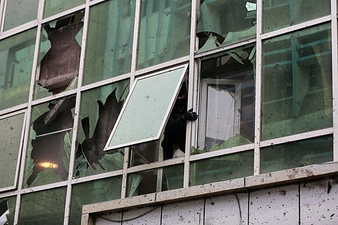Damage to a building across the street is seen a day after an explosion at a Chinese restaurant killed at least seven people, including a Chinese national, in Kabul, Afghanistan, Tuesday, Jan. 20, 2026.