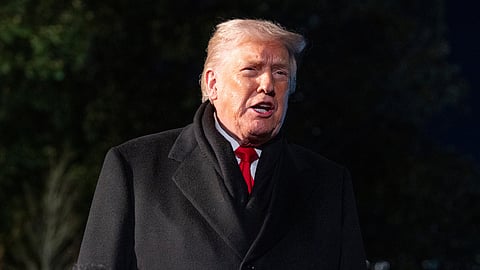 US President Donald Trump speaks before departing on Marine One from the South Lawn of the White House, Tuesday, Jan. 20, 2026, in Washington.