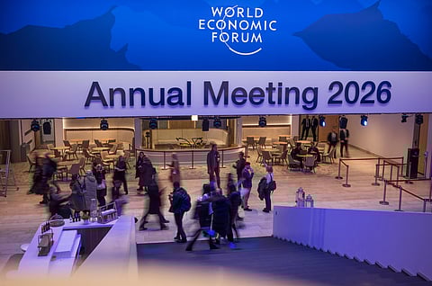 People gather in front of the main hall at the Congress Center where the Annnual Meeting of the World Economy Forum will take place in Davos, Switzerland, Sunday, Jan. 18, 2026.