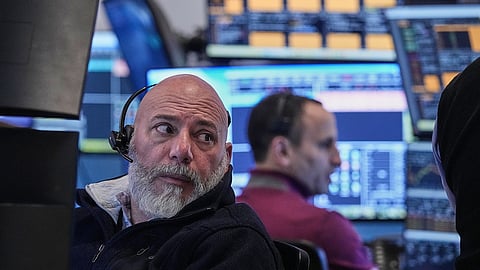 Trader Vincent Napolitano, left, on the floor of the New York Stock Exchange, Tuesday, Jan. 20, 2026.