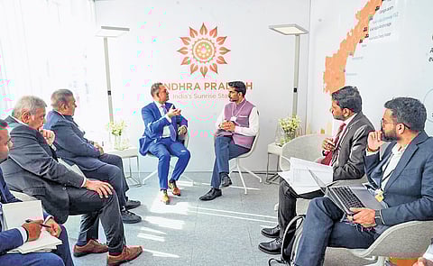 IT Minister N Lokesh talks with RMZ Group representatives on Tuesday.