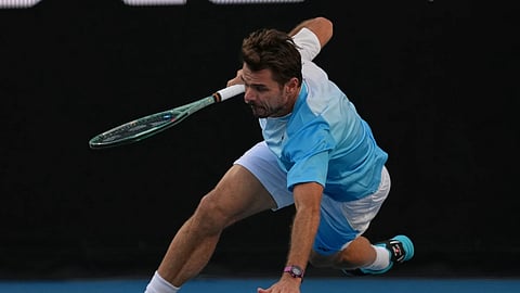 Stan Wawrinka of Switzerland falls during his second round match against Arthur Gea of France at the Australian Open tennis championship in Melbourne, Australia, Thursday, Jan 22, 2026.