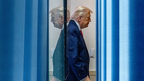 US President Donald Trump departs after speaking with reporters in the James Brady Press Briefing Room at the White House, Tuesday, Jan. 20, 2026, in Washington.