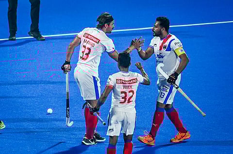 Harmanpreet Singh (R) celebrates with his teammate