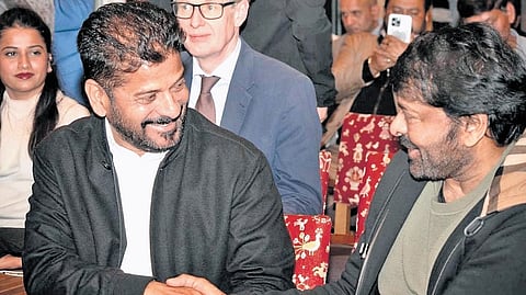 Chief Minister A Revanth Reddy and actor Chiranjeevi greet each other during the World Economic Forum summit at Davos on Wednesday. Chiranjeevi, who was in Zurich, attended the event on an invitation from the chief minister