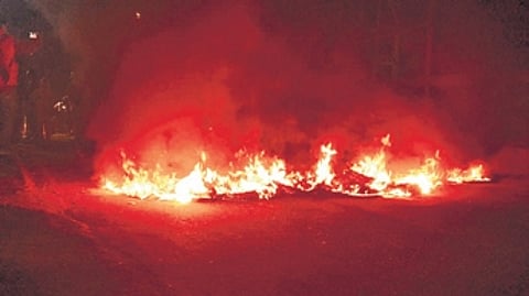 Tyres burning on Jagatsinghpur-Alipingal road at Haat Bazaar.