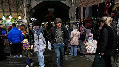 People walk at Tehran's historic Grand Bazaar on Tuesday, Jan. 20, 2026, in Iran.
