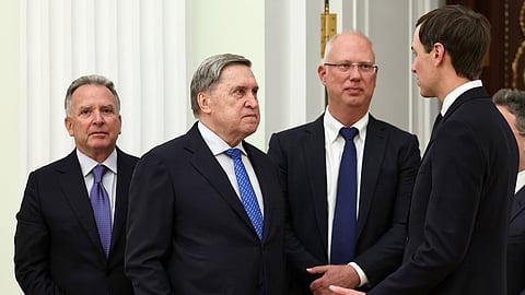U.S. President Donald Trump's envoy Steve Witkoff, left, Kremlin foreign policy adviser Yuri Ushakov, second left, Putin's envoy Kirill Dmitriev, second right, and Trump's envoy Jared Kushner talk to each other prior to their meeting with Russian President Vladimir Putin at the Senate Palace of the Kremlin, in Moscow, Thursday, Jan. 22, 2026.