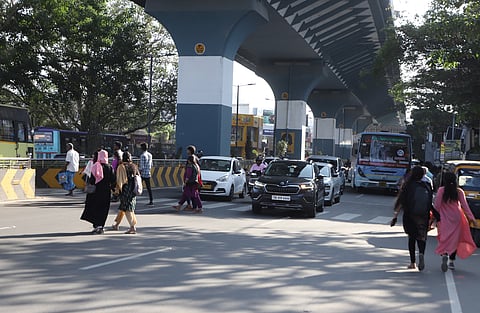 Pedestrians crossing Avinashi road under GD Naidu flyover at Nava India in Coimbatore on Friday.